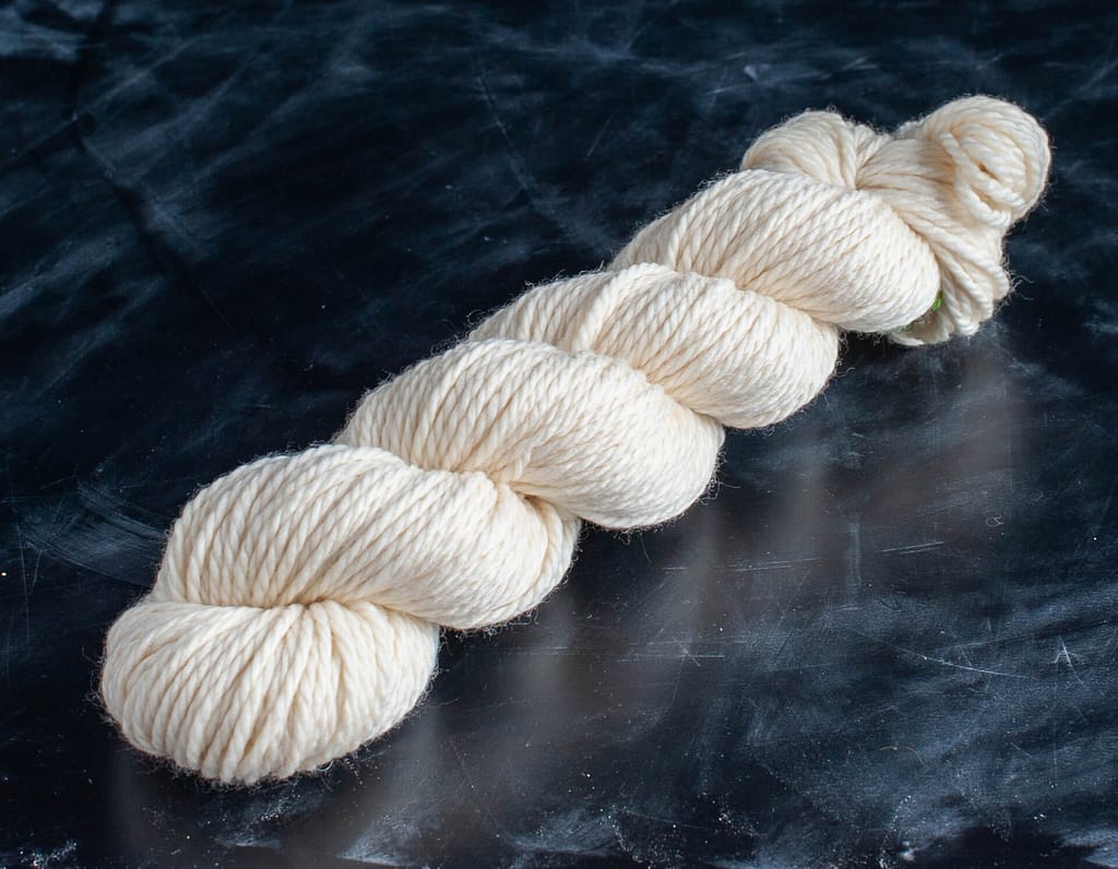 A skein of undyed merino chunky yarn 