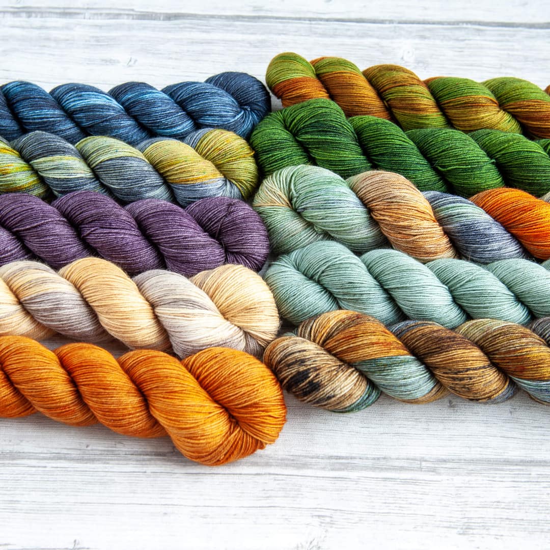 A skein of each of the colorways of the Kilt-y Pleasures collection