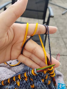 Holding two strands of yarn