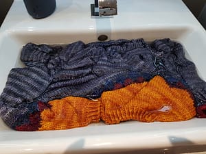 Knit sweater being washed