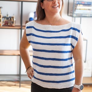 Woman wearing the Harbor Top in white with blue strips