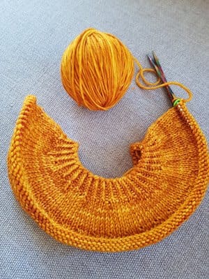 About two inches of the circular yoke are knit