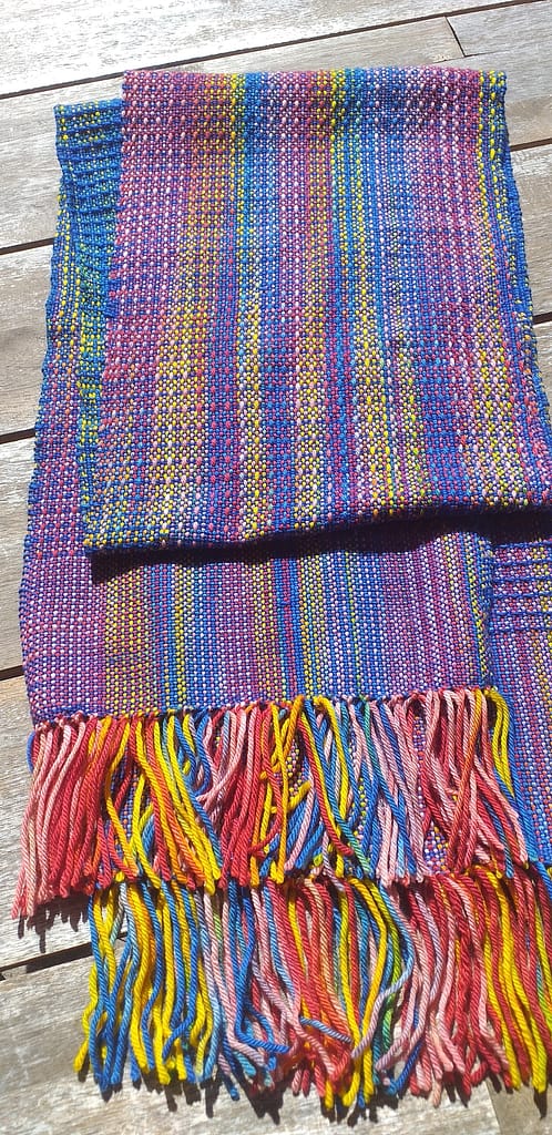 Another weaving project: colorful scarf woven with Merino Fingering