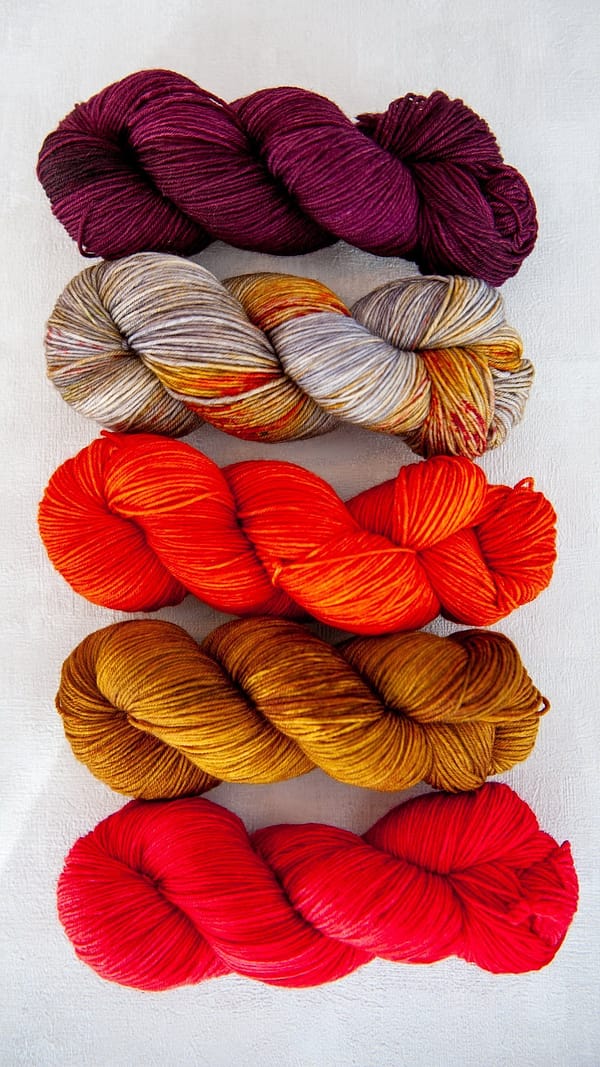 All five colors of main skeins for the sock sets next to each other