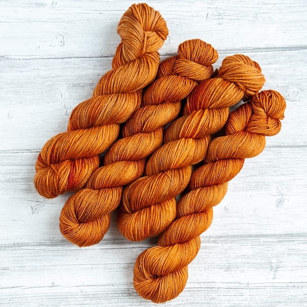 four skeins of yarn in the colorway 'Heilan Coo'