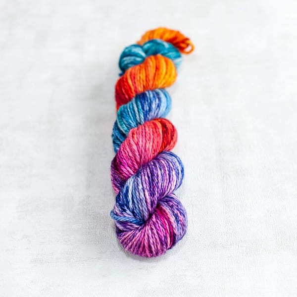 two skeins of chunky weight multi-colored yarn