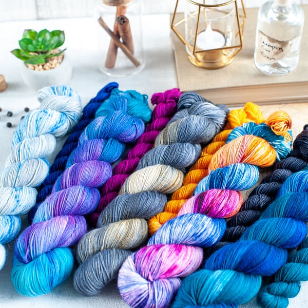 multiple colorful skeins of yarn next to each other