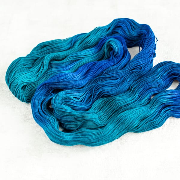 an open skein of blue and green yarn