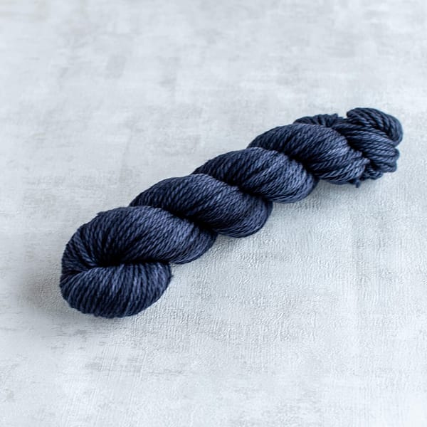 one skein of chunky weight blue-black yarn