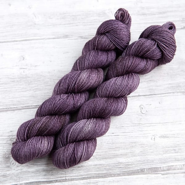 two skeins of yarn in the colorway 'Thistle'