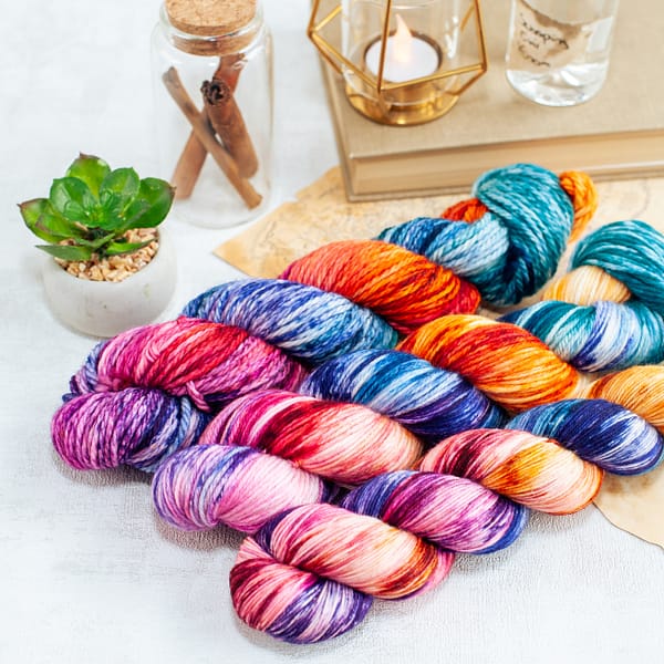 three skeins of multi-colored yarn