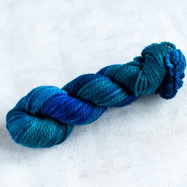 a chunky skein of blue and green yarn