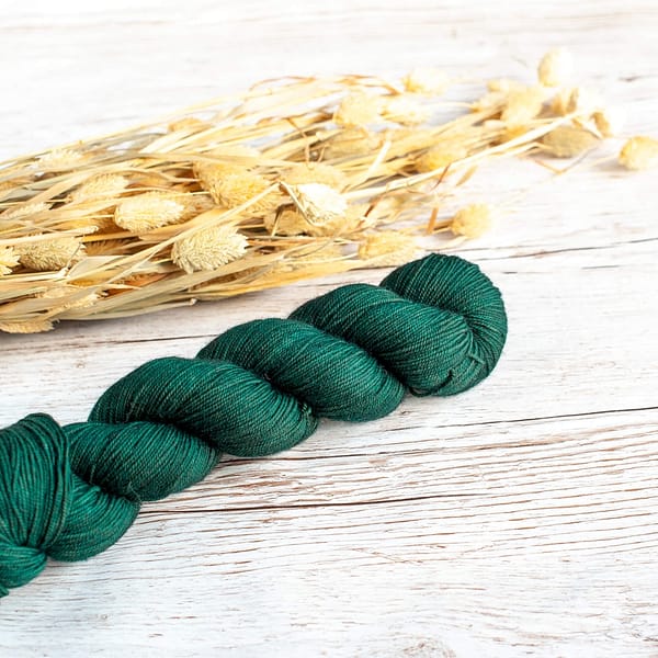 A skein of dark green yarn