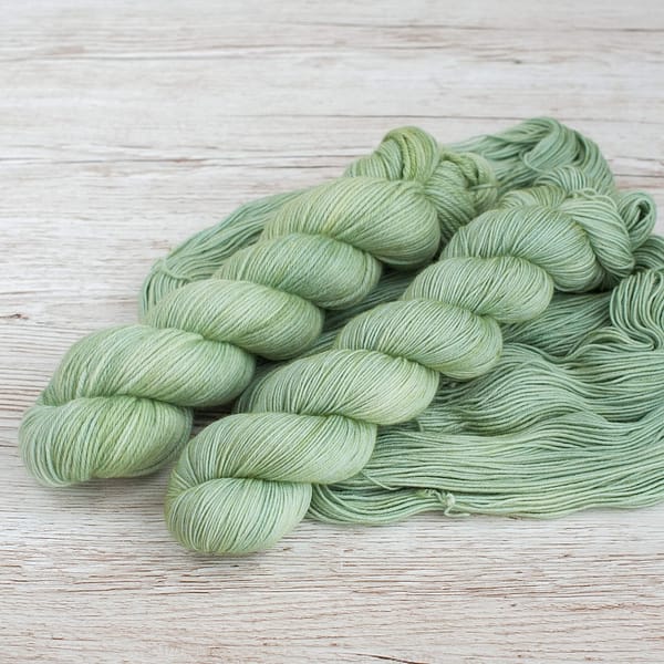 Two skeins of pale green yarn 