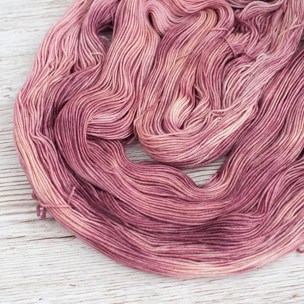 A skein of Vintage Rose yarn laid flat