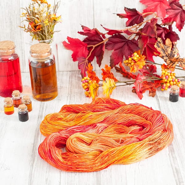 A red and orange skein of yarn laying open