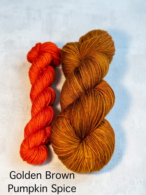 A sock set with the main skein in golden-brown and a mini skein in orange
