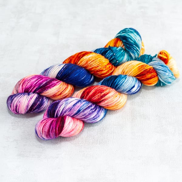 two skeins of DK weight multi-colored yarn