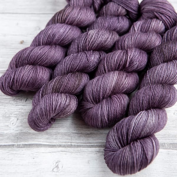 four skeins of yarn in the colorway 'Thistle'