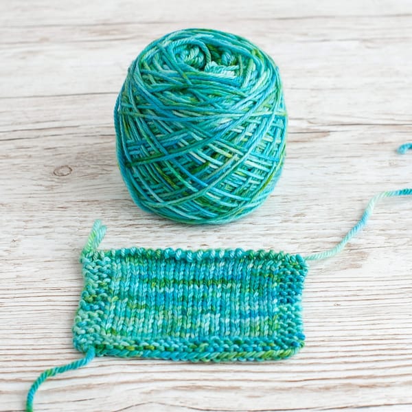 A cake and swatch of the colorway Pond