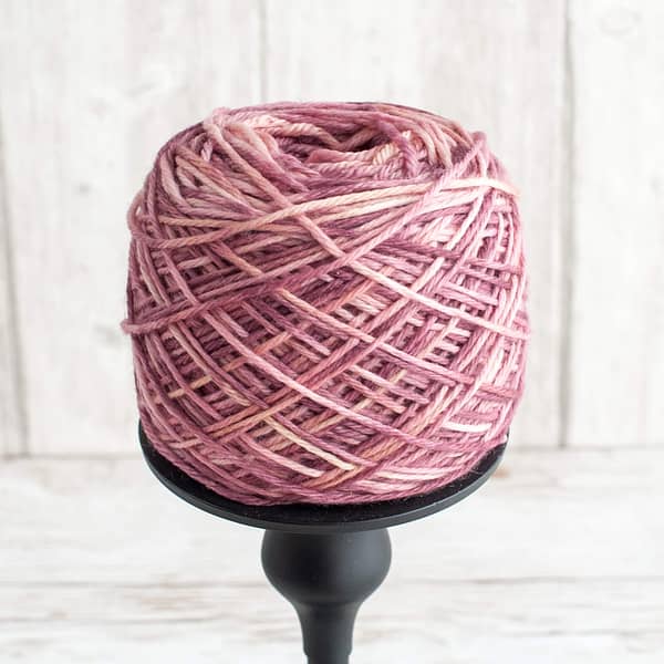 One skein of Vintage Rose yarn wound into a cake