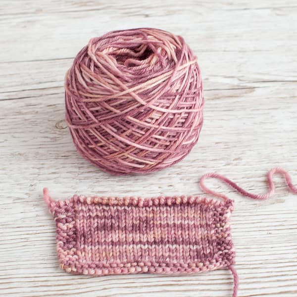 A swatch and cake of Vintage Rose yarn