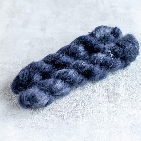 two skeins of  blue-black kid silk mohair yarn